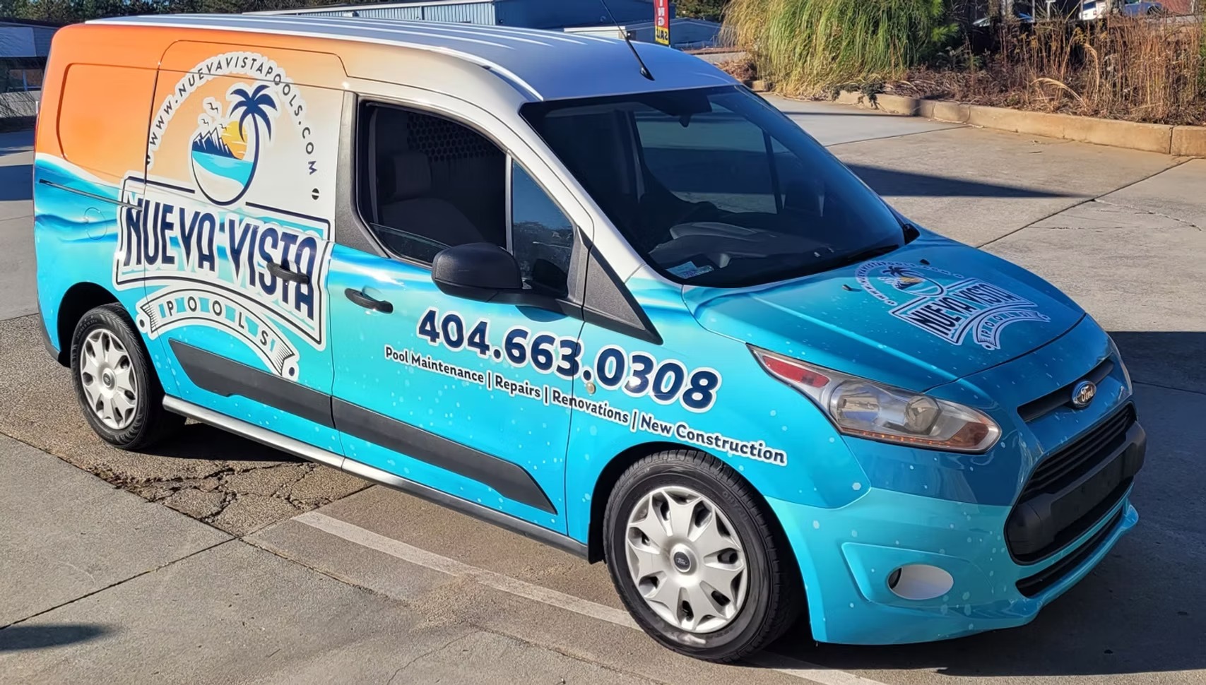 Nueva Vista Pools service van wrapped in turquoise and orange graphics